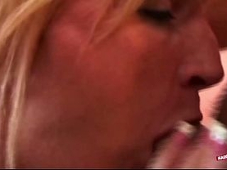 Watching the blonde milf desperately using the dildo made him want to pound her insides